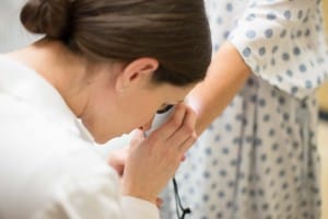 Doctor performing skin analysis