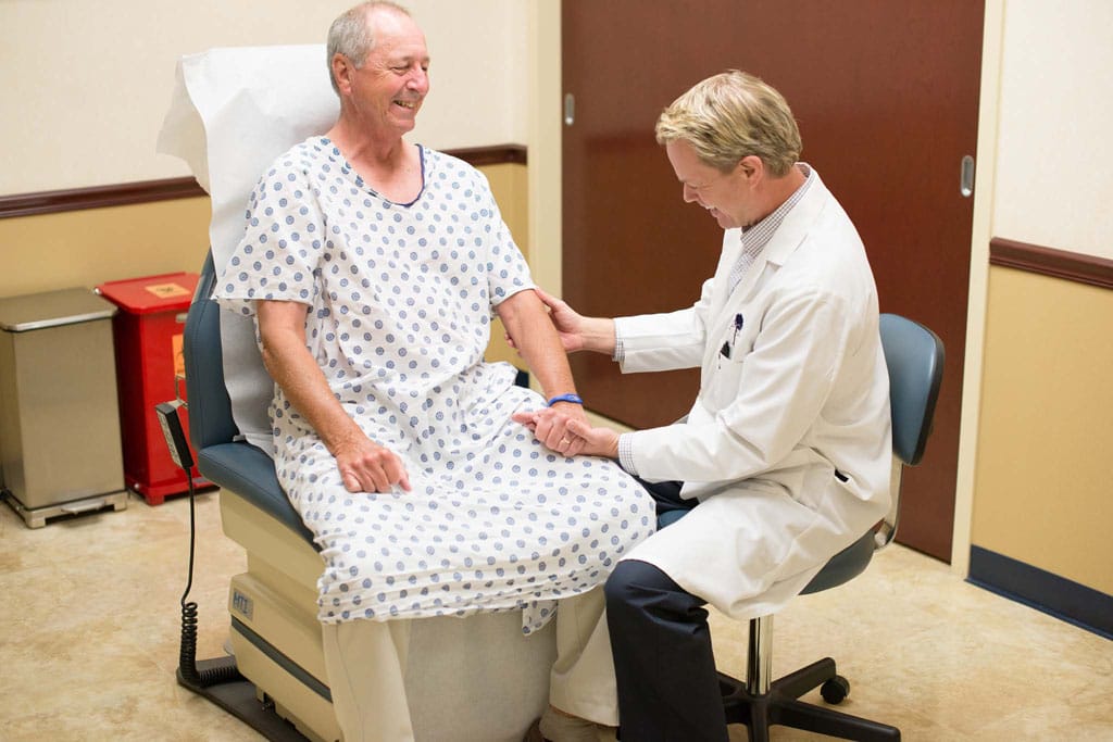 Doctor inspection patients arm