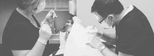 Doctor performing facial treatment