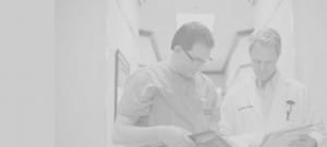 Doctors reviewing patient files