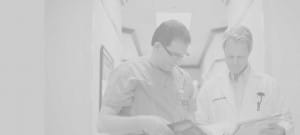 Doctors reviewing patient files