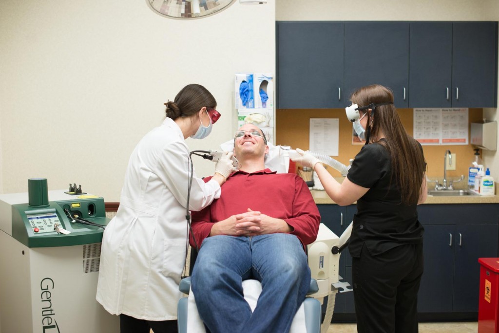 Man in doctors chair receiving dermotological care