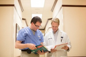 Doctors reviewing patient files